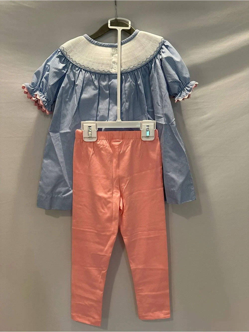 Blue Gingham Smocked Top with Pink Leggings with Matching Bow.